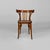 Set of four chairs in wood. The backrest and armrests are composed of curved wooden slats. Round-section legs. 1940s. Good...
