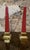 Pair of decorative obelisks in red-tinted resin, mounted on a profiled brass base. Purchased in 1990 from Jacques...