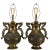 A striking matched pair of repoussé brass table lamps in the Hollywood Regency taste, inspired by the celebrated designs...