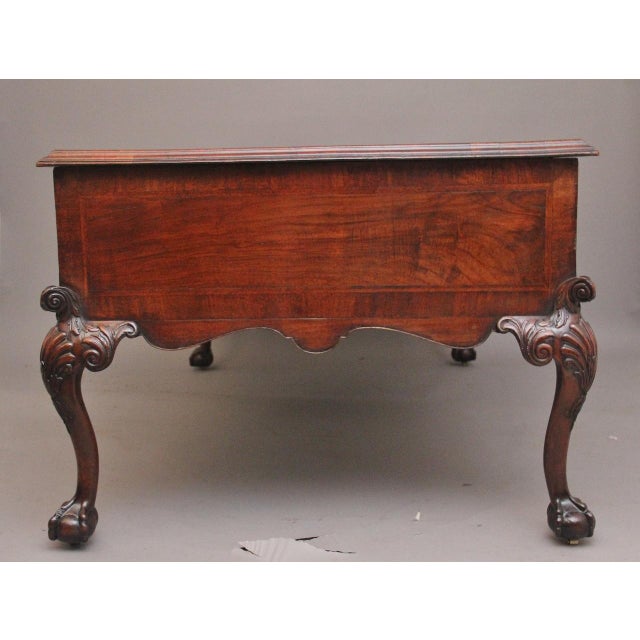 A large and impressive 19th Century walnut partners desk of exceptional quality, having a wonderful figured top that is...