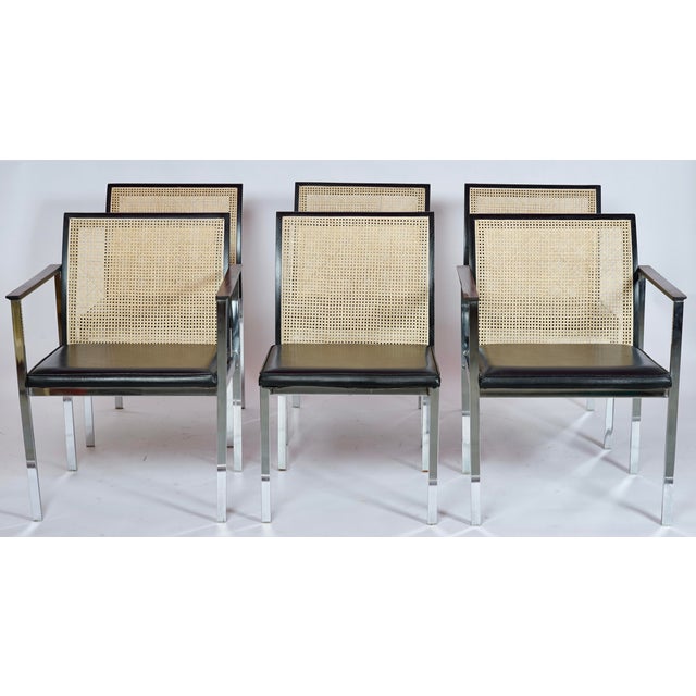These are Mid-Century Paul McCobb for Lane chrome dining chairs featuring black vinyl seats and new caned backs. Six all...