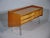 Beautiful original lowboard made of cherry wood with very rare brass hairpins and rear brass legs. The sideboard is...