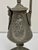 13" tall mantle ewer decorated with classical Greek female figures of Melmopene, the Goddess of Tragedy, on one side and...
