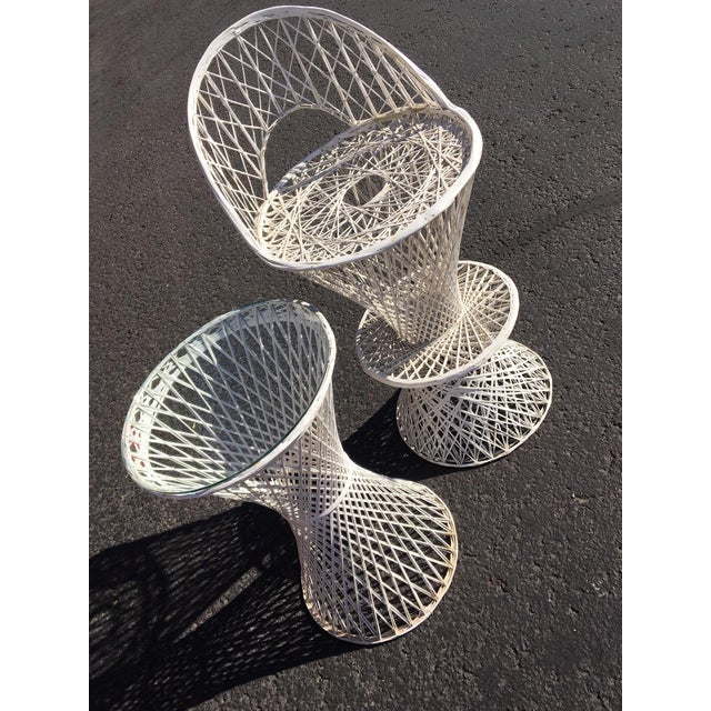 Two Piece Mid Century Modern Spun Fiberglass Table and High Chair. Features white hourglass shape table with glass top and...