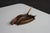 Antique copper ashtray by Berry & Co., featuring a hand-hammered bowl with a sculptural deer antler handle and natural...