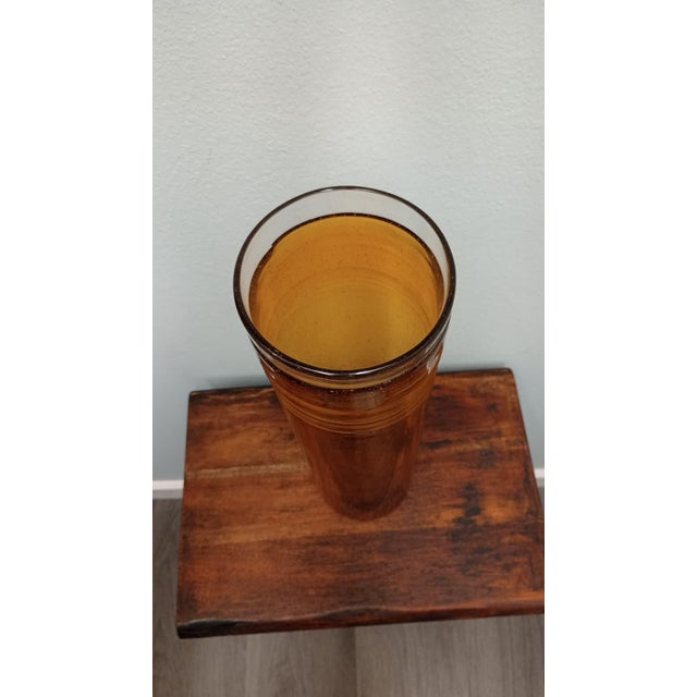 This is a mid-century modern style accent. Tall, amber-colored glass cylinder vase minimalist silhouette. Tubular design...