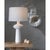 Enhance your space with the Sabina Table Lamp, a modern marvel with a distinctive silhouette. The lamp features a ceramic...