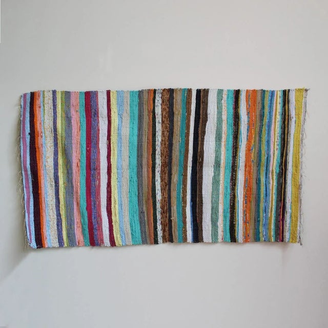 Bright and colorful striped Sari rug made from recycled cotton fabrics repurposed into fun striped rugs. Colors vary and...