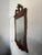 Handsome federal style wall mirror circa 1940 featuring a richly figured mahogany frame with satinwood-style inlay, a...