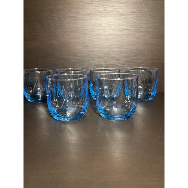 For sale is a vintage set of 7 Anchor Hocking "Misty Blue" Optic Swirl drinking glasses. Produced in the 1980s, these...