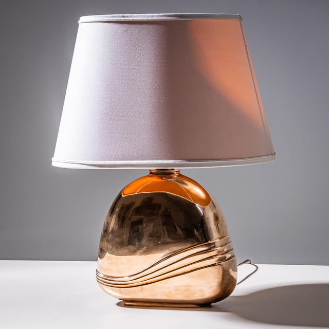 Two petite table lamps with metal bodies by Esa Fedrigolli. Incised signature to the base. Metal is a warm rose toned...