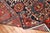 an accent size navy and rust Persian Heriz Karadja Rug from the early 20th century. part of a matching pair to item j3716