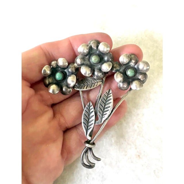 Stunning vintage sterling silver and turquoise Triple flower stem brooch.