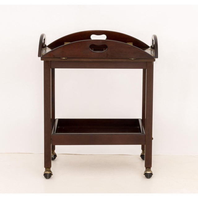 Bombay Company Mahogany Rolling Tea Trolley, the removable butler's tray top with articulated handles on four legs...