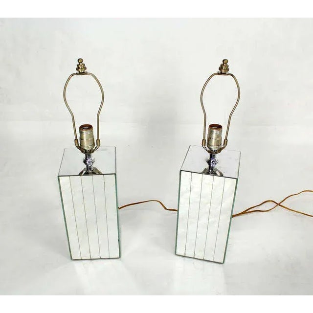 Pair of vintage mid-century mirrored tables lamps. The pieces are cube shaped.