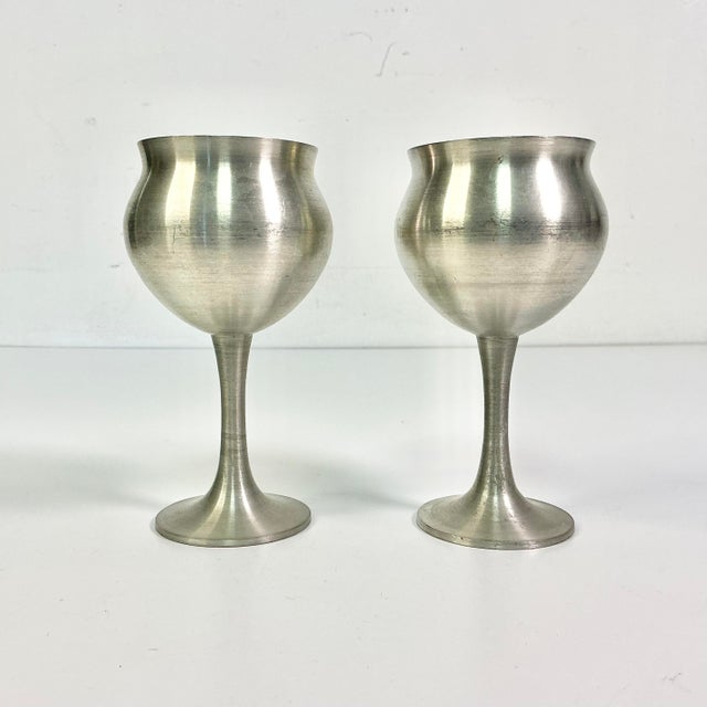 These are a pair of Pewter Wine Goblets with an engraved date of May 27, 1981. We assume these are from a wedding. But we...