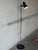 This adjustable metal floor lamp delivers sleek task lighting with a single directional spotlight shade. Built with a...