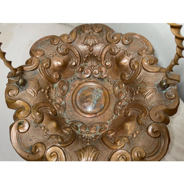 Explore the charm of handcrafted artistry with this antique tooled copper centerpiece bowl, a piece that exudes a timeless...
