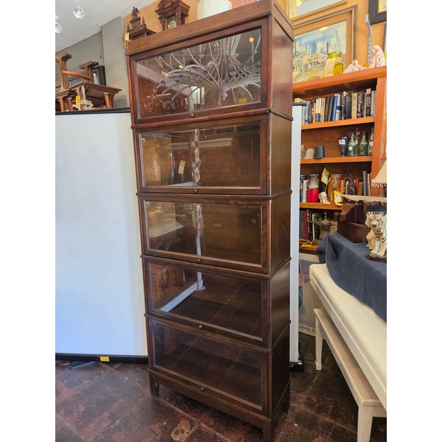 A very tall walnut Hale Lawyers Bookcase from the 1900s. This is a 5 stack each stack is 15 tall. 14 deep 35 across 88...
