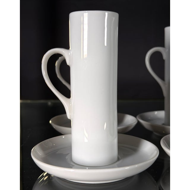 These six demitasse cups and saucers by LaGardo Tackett for Schmid are a study in modernist restraint, with the tall...
