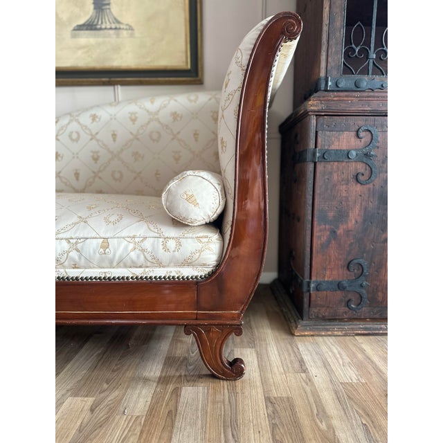 Elegant antique mahogany recamier chaise lounge with beautifully scrolling ends, a shaped back, and finely detailed curled...