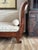 Elegant antique mahogany recamier chaise lounge with beautifully scrolling ends, a shaped back, and finely detailed curled...