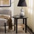 Introducing the Rakoma 1 Shelf End Table where form meets function. This stylish end table combines the bold allure of...