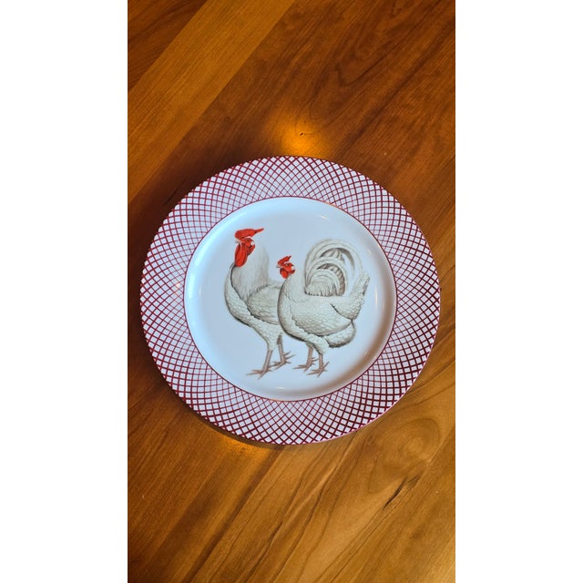 Adorable plate perfect for a Cottagecore interior! Plate has bright red painted lines around the edges, and depicts two...