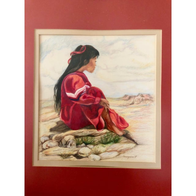 A girl in a rich red dress contemplating the southwestern terrain. Professionally Double matted and framed.