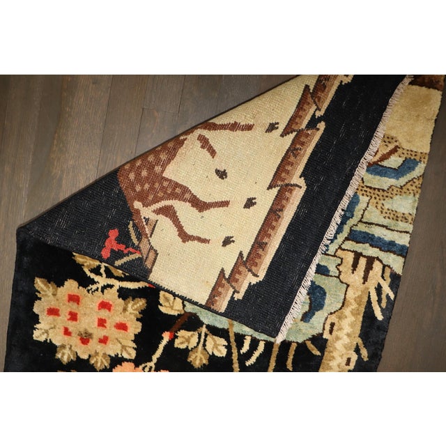 An early 20th century Chinese Batou Pictorial Rug