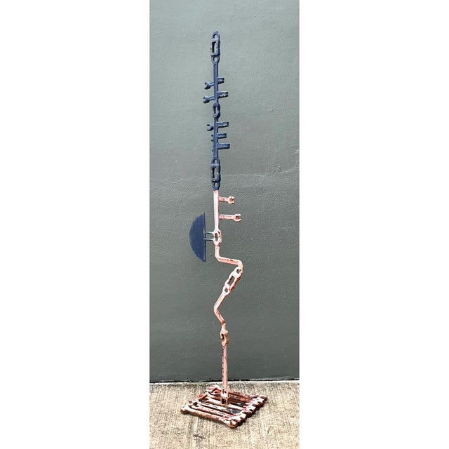 Crafted from an ingenious assemblage of welded metal wrenches, this striking mid-20th-century sculpture exemplifies...