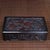 This is an exquisitely crafted rectangular wooden box, featuring intricate, deep relief carving across its surfaces....