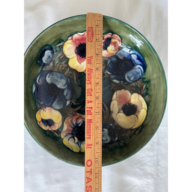 Fabulous large Moorcroft bowl from the Walter Moorcroft period set on a rich dark green background in the anemone pattern...