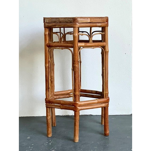 This masterfully constructed vintage plant stand captures the organic elegance of mid-century tropical design. Crafted...