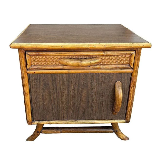 Pair of James Mont styled Mid-century rattan nightstands with woven sides and Formica tops each featuring rattan pulls and...