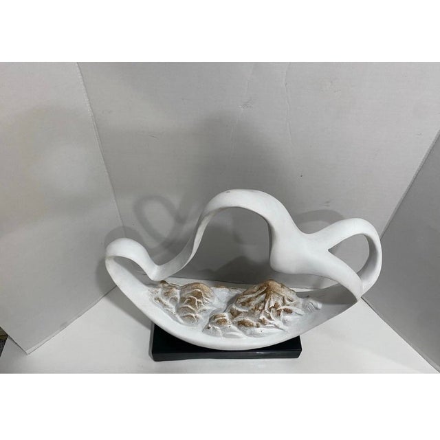 This sculpture is purely as a decorative object, this piece reads beautifully from all angles and works equally well as a...