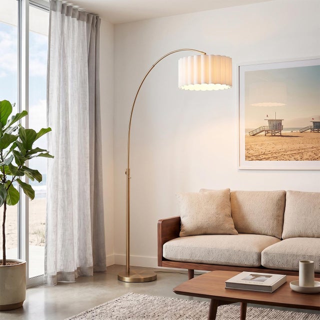 The Scallop 92" Arc Lamp is a Modern arc lamp with a weathered brass steel frame, designed by Peter Morelli in 1960. This...