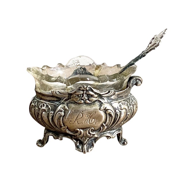 This pair of antique open salts features a German hallmarked silver mount, and bears 800 silver marks with monogram...