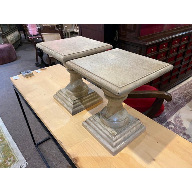 Beautiful pair of vintage turned wood pedestal stands featuring elegant proportions and a warm natural finish. The...