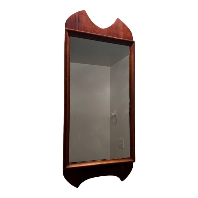 Wood framed Mid Century Modern hanging mirror. Circa 1940s
