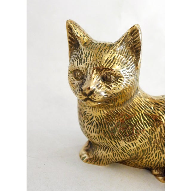 Cat figurine sculpture, depicted lying down Beautifully detailed with grooved, hollow fur All gilded brass, assembled in...