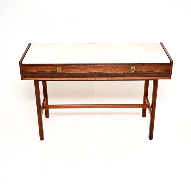 An extremely rare and impressive vintage marble top console table by Robert Heritage for Archie Shine. This was made in...