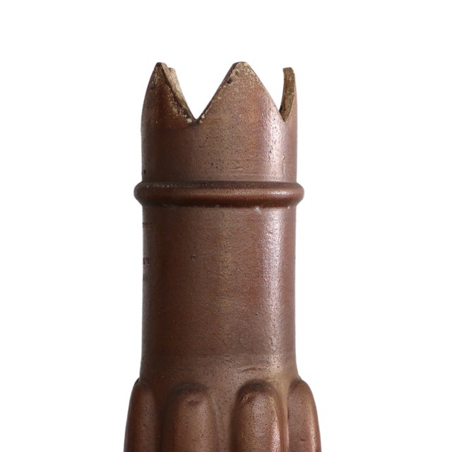 Transport the ambiance of 19th-century France into your living space with this striking terracotta chimney top, boasting a...