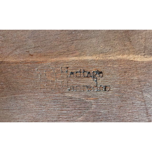 A beautifully crafted walnut coffee table by Henredon, blending refined mid-century lines with bold decorative character....