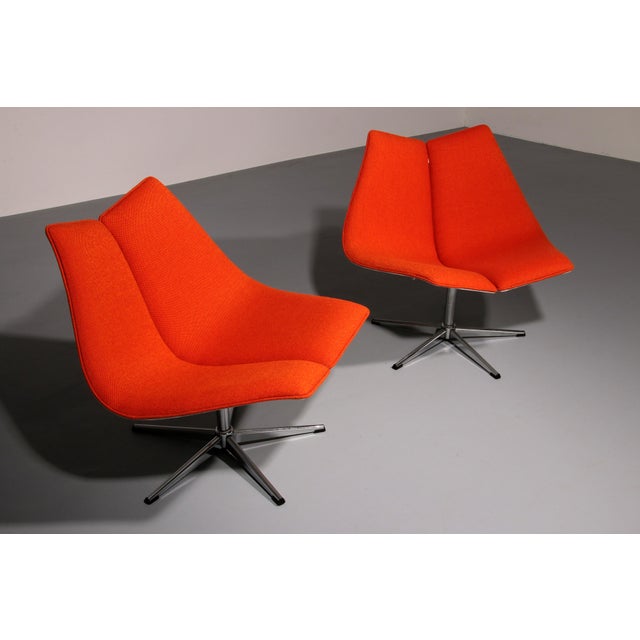 Step into a world of timeless Scandinavian elegance with this striking pair of 1970s swivel lounge chairs attributed to...