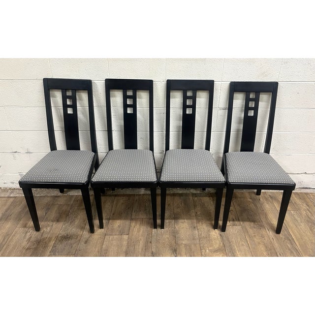 This is a gorgeous set of four Postmodern black ebonized slot back dining chairs, possibly by Josef Hoffmann with elements...