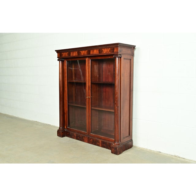 A beautiful antique American Empire or Victorian glass front double bookcase In the manner of R.J. Horner & Co. USA, Circa...