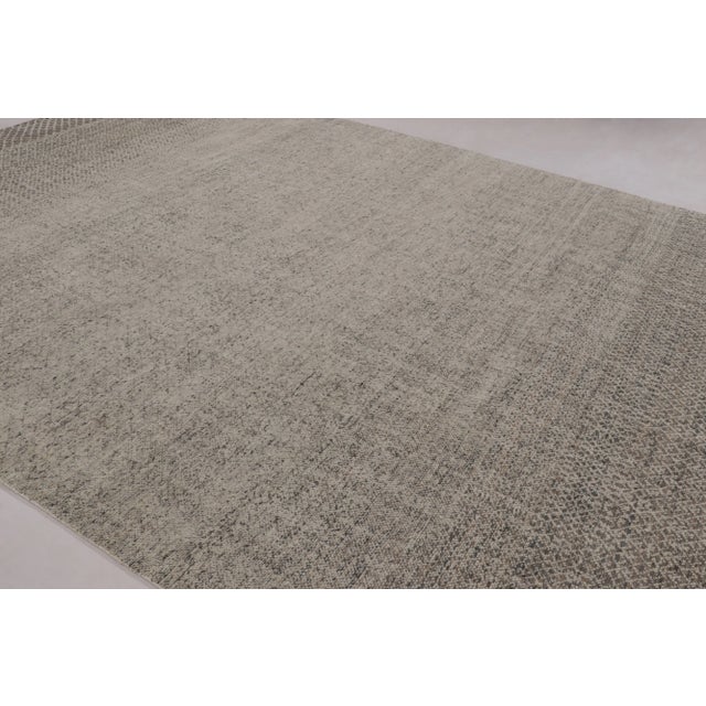 This magnificent 10x14 rug from Rug & Kilim’s Modern Collection is a masterful study in tonal depth and micro-geometric...