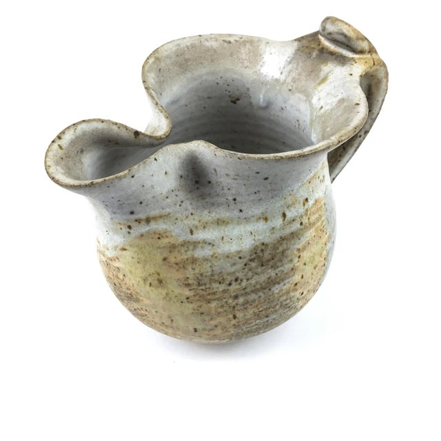 Nice details on this cool pottery pitcher. This piece has been handcrafted and fired to show off the beautiful lines of...