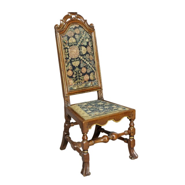 Each with a shaped, carved and pierced crest rail over period needlepoint seats and backs raised on block and turned legs...